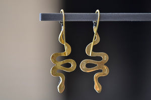 
            
                Load image into Gallery viewer, Snake Drop Earrings by Arman Sarkyssian are 22k gold snakes with oxidized sterling silver details, accent  pavé diamonds and engraved details on earring hooks. From the back.
            
        