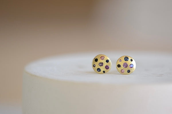 Polly Wales Small Fancy Celeste Disc Stud Earrings in Serpentine are classic, 18k recycled yellow gold disc earrings with pink, purple, blue and black sapphires, cast not set, cast in place and made in Los Angeles.