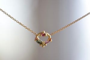 
            
                Load image into Gallery viewer, Polly Wales Des Gouttes Necklace in Blossom Crush with pink, lilac, orange and green sapphires on 18k yellow gold wreath circle and 16.5&amp;quot; chain.
            
        