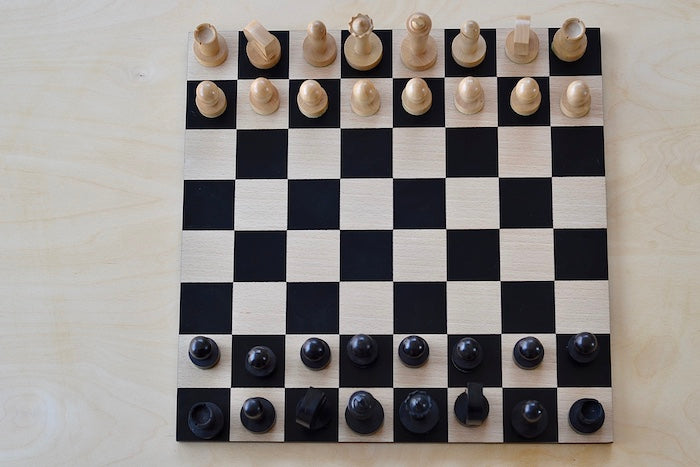 
            
                Load image into Gallery viewer, New Berliner Chess Set with pieces set our on board in birds eye view.
            
        