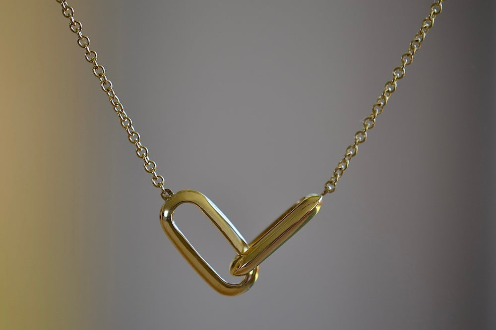 Linked Necklace by Lizzie Mandler is made out of two connected knife edge oval clip links in 18k yellow gold on a gold chain. Made in Los Angeles.