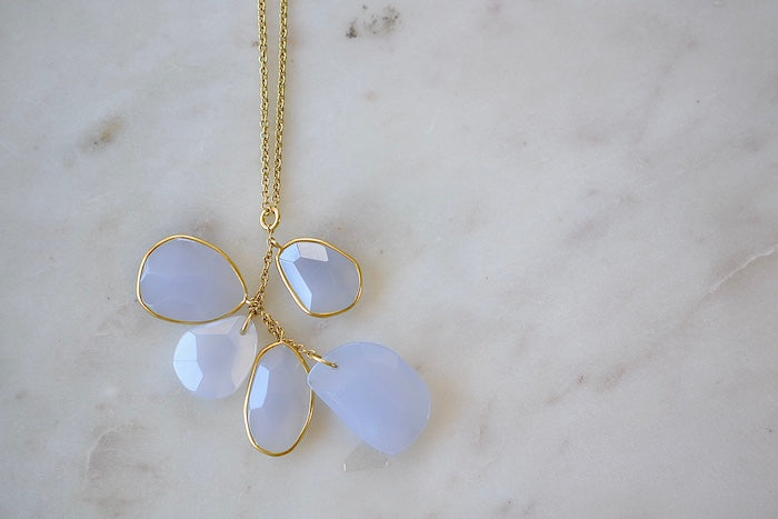 
            
                Load image into Gallery viewer, Colette Drill Cluster Five Stone Pendant Necklace in Chalcedony Pendant by Pippa Small is a  cluster of five organically shaped, lightly faceted and translucent pale lilac chalcedony stones of which three are bezel set and all are clustered on a chain in 18k yellow gold to form this necklace. 
            
        