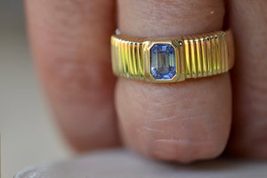Retrouvai Pleated Blue Sapphire Solitaire with tapered band in 14k yellow gold, Emerald cut sky blue sapphire signet or wedding band, One of a kind - size 7.25 (minor sizing adjustments possible).