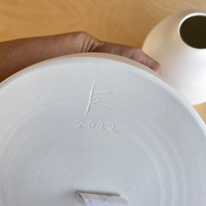 Signature on Lilith Rockett Urn Vase is wheel thrown porcelain with gloss glaze on the interior and an unglazed exterior.