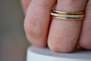
            
                Load image into Gallery viewer, Wearing the White Diamond Spinner Eternity Band by Elizabeth Street Jewelry.
            
        