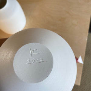 Signature on Lilith Rockett Large Round Vase is wheel thrown porcelain with gloss glaze on the interior and an unglazed exterior.