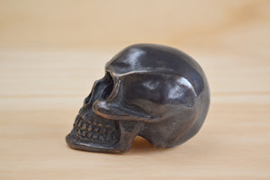 Bronze Object "Skull" by Anne Ricketts.