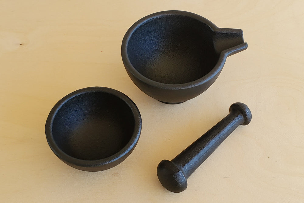 
            
                Load image into Gallery viewer, Cast Iron Mortar and Pestle from Zassenhaus Sturdy solid cast iron construction.  Mortar, pestle and stacked n bowl.  Designed in Germany, produced to a high European standard of quality.  Functional and attractive.  Will last a lifetime. 
            
        