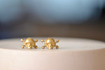 Small Skull & Bone Earrings with Baguette Diamonds