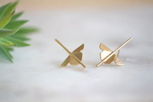 
            
                Load image into Gallery viewer, Kaylin Hertel single Lotus Stud earring in 14k yellow gold with two diamonds is made out of Abstract motif formed from creases of gold balanced on a stick.
            
        