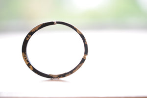 Side view of Dust Nail bracelet by Pat Flynn.