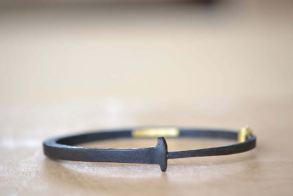 Pat Flynn Standard Mens Plain Nail Bracelet, forged in blackened iron with an 18k gold hinge.