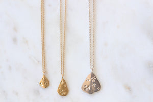 
            
                Load image into Gallery viewer, Petal Pendant necklaces by Kaylin Hertel in Gold and silver.
            
        