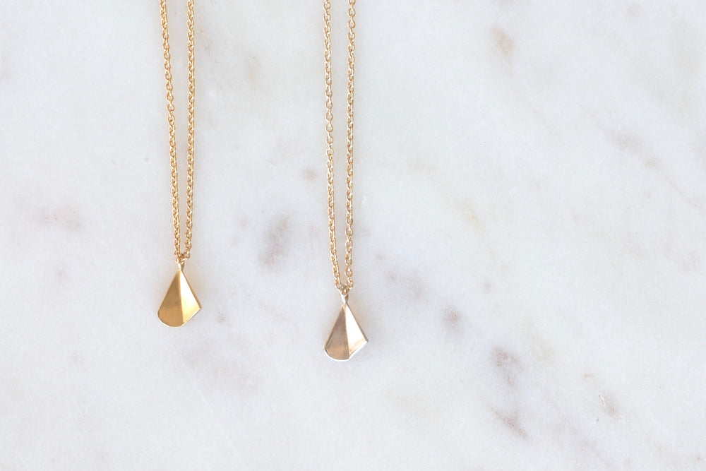 Flicker Pendant Necklace by Kaylin Hertel in Gold and Silver.