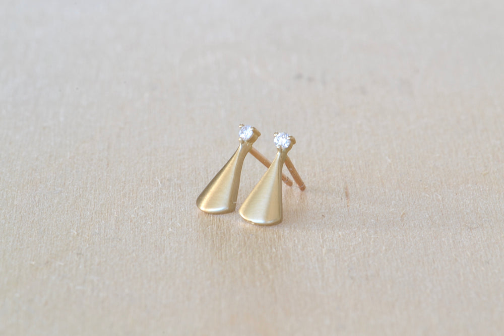 Kaylin Hertel light Ray stud earrings with white Canadian diamond accents in 14k yellow gold and satin finish.