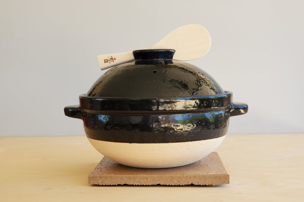 Donabe with rice spoon.