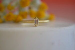 Elizabeth Street Diamond Baguette Ring White Eagle Claw prong setting 1.5 mm band 18k yellow gold
