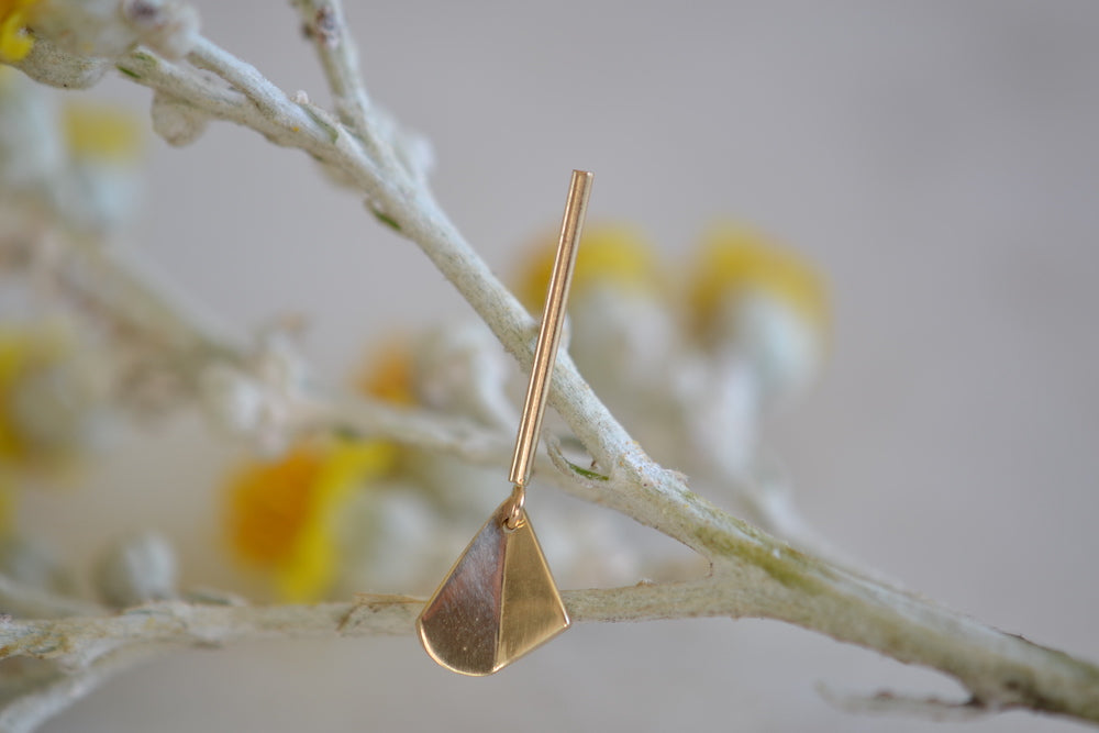 
            
                Load image into Gallery viewer, Kaylin Hertel 14k yellow gold flicker stud is a bent leaf on bar with post closure sold as single earring stud.
            
        