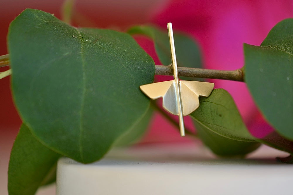
            
                Load image into Gallery viewer, Kaylin Hertel single Lotus Stud earring in 14k yellow gold  is made out of Abstract motif formed from creases of gold balanced on a stick.
            
        