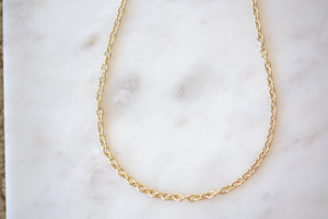 Small Rolo Chain in 14k gold.