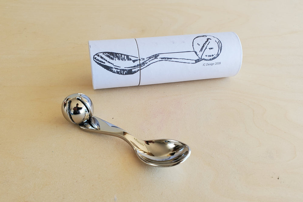 Baby spoon with bell designed by Robert Butler.