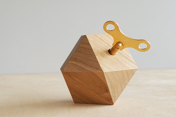 Music Box in wood in the shape of a diamond.