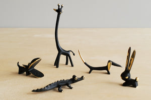 
            
                Load image into Gallery viewer, Tiny Austrian Brass Figurines by Walter Bosse  darkened with patina. Giraffe, hippo, Dachshund, alligator and rabbit.
            
        