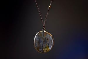 Rutilated Quartz Pendant Necklace with Inclusions by Margaret Solow set in 14k gold from the back.
