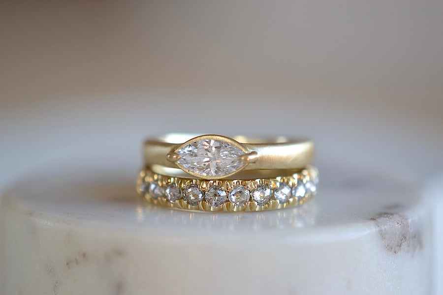 
            
                Load image into Gallery viewer, Elizabeth Street Jewelry Euro Wedding Band for women is a rose cut half eternity euro band made out of salt and pepper diamonds set into this unique and made for stacking 2 - 3mm tapered 14k yellow gold ring and solitaire wedding set..
            
        