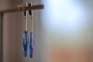 Kyanite on Stick and Strand Earrings by Kathleen Whitaker are One of a kind deep blue kyanite stones with natural inclusions that are drilled and prism shaped and attached to Kathleen Whitaker's signature stick and strand with post closure. Stone collection.